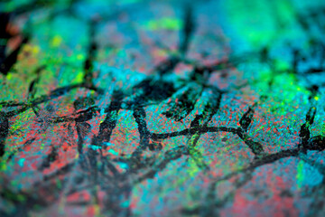 Thick abstract paint surface with heavy texture looking a bit like graffiti hand drawn real dark background
