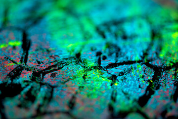 Thick abstract paint surface with heavy texture looking a bit like graffiti hand drawn real dark background