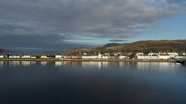 Drone footage of coastal houses in Ullapool
Village in Scotland under cloudy sky