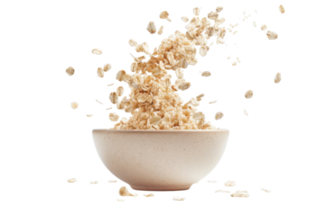 Fluffy oats cascaded gracefully into a simple bowl against a bright white backdrop