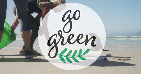 Image of go green text and logo over two caucasian women picking up rubbish from beach