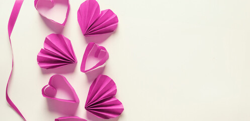 Border of pink paper hearts on white background, banner