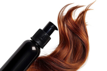 Elegant bottle of hair treatment beside flowing strands of vibrant red hair on a clean surface