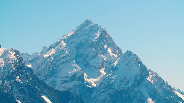 mountains range Dolomites Italy near cortina d'Ampezzo with snow peaks on rocky against blue sky