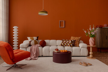 Modern interior with curved sofa and geometric cushions in warm tones.