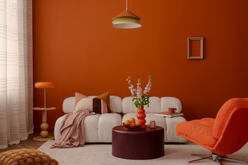 Modern set up of interior design with white modular sofa, orange armchair and stylist decorations. Home decor.