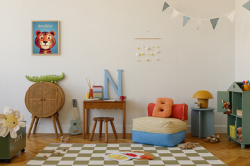 Creative and cozy kids' area with a striped pouf, light blue guitar, oversized letters, and a...