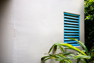 Blue Wooden Ventilation Vents On Building Walls