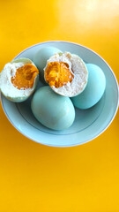 Salted egg served on toast and white plate