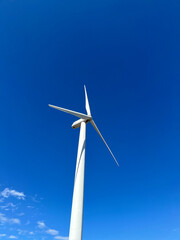wind turbine or wind power plant. Concept of energy and progress, as the turbines harness the power...
