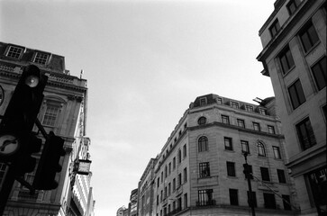 Analog monochrome view of london buildings and traffic light