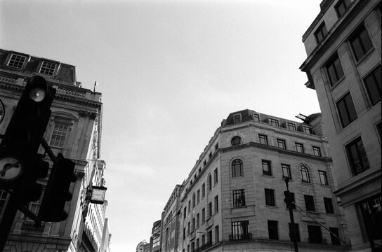 Fototapeta Analog monochrome view of london buildings and traffic light