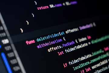 Swift function code on screen showing folder deletion logic with animation and loop structure