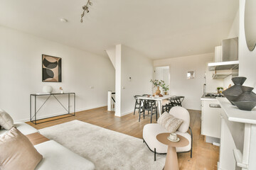 A stylish modern living room featuring minimalist decor, natural light, and tasteful furnishings,...