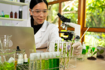 Doctor biotechnology working indoors laboratory research scientist to analyzing and development about seed and growth of herb for safety protect and education virus liquid