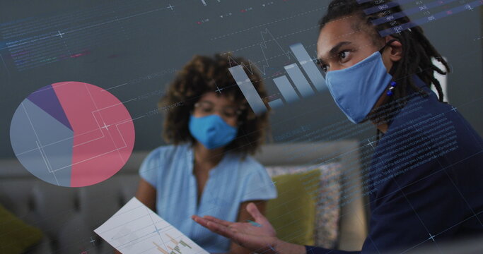 Image of data processing over biracial businessman with face mask - Powered by Adobe