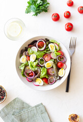Salad with eggs, tomatoes, onions and radishes. Healthy eating. Vegetarian food.
