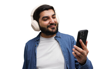 Engaged Young Man Enjoys Music While Using Smartphone With Wireless Headphones in a Cheerful...