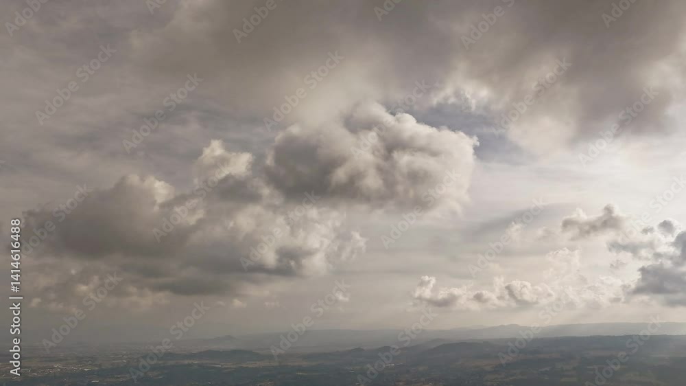 Poster white fluffy clouds float by in a smooth time-lapse capturing peaceful sky movement.