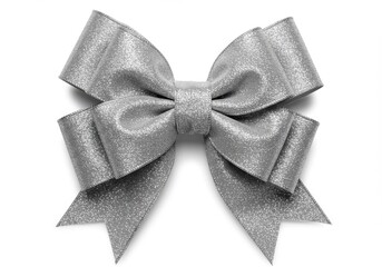 Close up of a shiny silver glitter bow with multiple loops and tails on a plain white background space