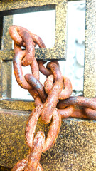 Old rusty metal chain links closeup on white background