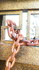 Old rusty metal chain links closeup on white background