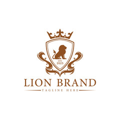 Luxury Lion crest heraldry logo. Elegant gold heraldic shield icon. Premium brand identity emblem. Royal coat of arms company label symbol. Modern vector illustration.