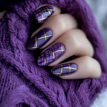 Stylish purple nails with gold designs