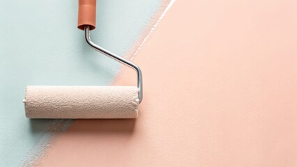 Obraz premium Painting roller on a two-tone wall with pink and blue colors. home renovation DIY painting concept