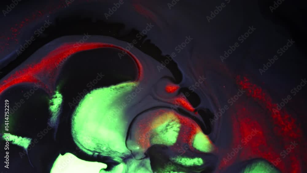 Poster abstract macro view of colorful liquids mixing in dark fluid, glowing red and green