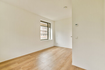 Bright and spacious room featuring clean lines and a neutral color palette, emphasizing simplicity and functionality in modern interior design.