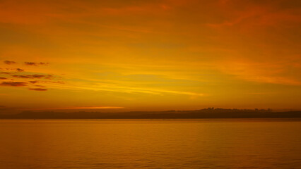 Stunning sunset over calm ocean waters