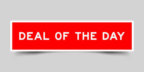 Red color square shape sticker label with word deal of the day on gray background