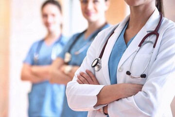 Fototapeta premium A group of healthcare professionals standing with confidence, demonstrating teamwork and expertise in medicine and patient care