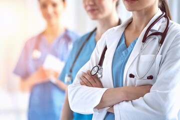 A group of healthcare professionals standing with confidence, demonstrating teamwork and expertise in medicine and patient care