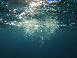 Bubbles under the sea in the crystal clear green sea water. Mediterranean bubbles. Real image very suitable for backgrounds, Rising Bubbles in Deep Underwater, Under with bubble. Great for background.