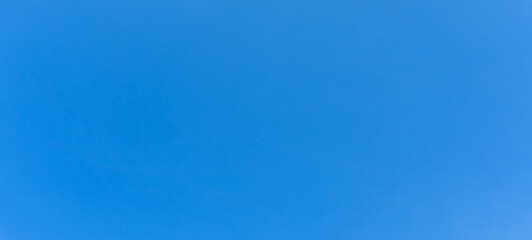 Low angle view and full frame of beautiful light blue sky without clouds in the morning or afternoon on sunny day used as natural background texture in decorative art work