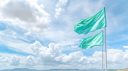 Two light teal flags waving against a bright blue sky with fluffy white clouds and distant mountains . Generative AI