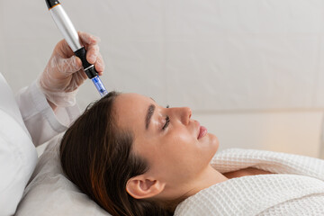 Alopecia. Woman hair loss treatment regeneration. Trichologist cosmetologist doctor applies vitamin...