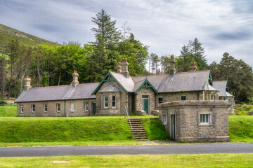 Silent Valley Reservoir stone cottage building, nestled in nature, boasts unique architecture and breathtaking views, ideal for photography, exploration, and relaxation, Northern Ireland