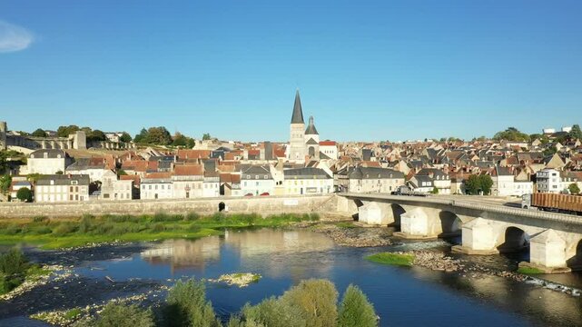 The ancient church of La Charite and its Loire bridge in Europe, in France, in Burgundy, in Nievre, in summer, on a sunny day.&nbsp;
