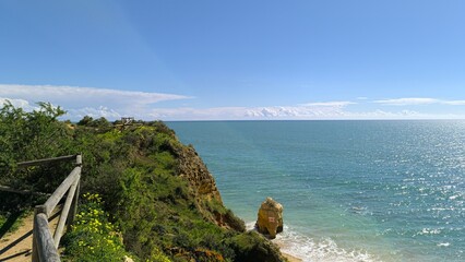A private corner of paradise surrounded by lush greenery and rocks. 