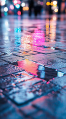 Naklejka premium Vibrant reflections on a wet city street at night