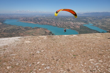 Scenic View of Lake Negrat&iacute;n in Andalusia, Spain &ndash; Turquoise Water and Arid Hills under a Clear Sky