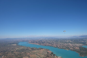 Scenic View of Lake Negrat&iacute;n in Andalusia, Spain &ndash; Turquoise Water and Arid Hills under a Clear Sky