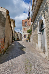 A narrow street between the old houses of San Giorgio la Molara in Campania, Italy.