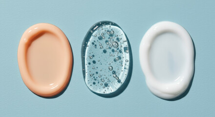 Skincare Swatches: Cream, Gel & Lotion Textures on Light Blue Background - Beauty Product Close-Up!