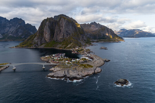 Aerial view of Hamn&oslash;y fishing village and iconic mountain landscape in Lofoten, Norway during autumn