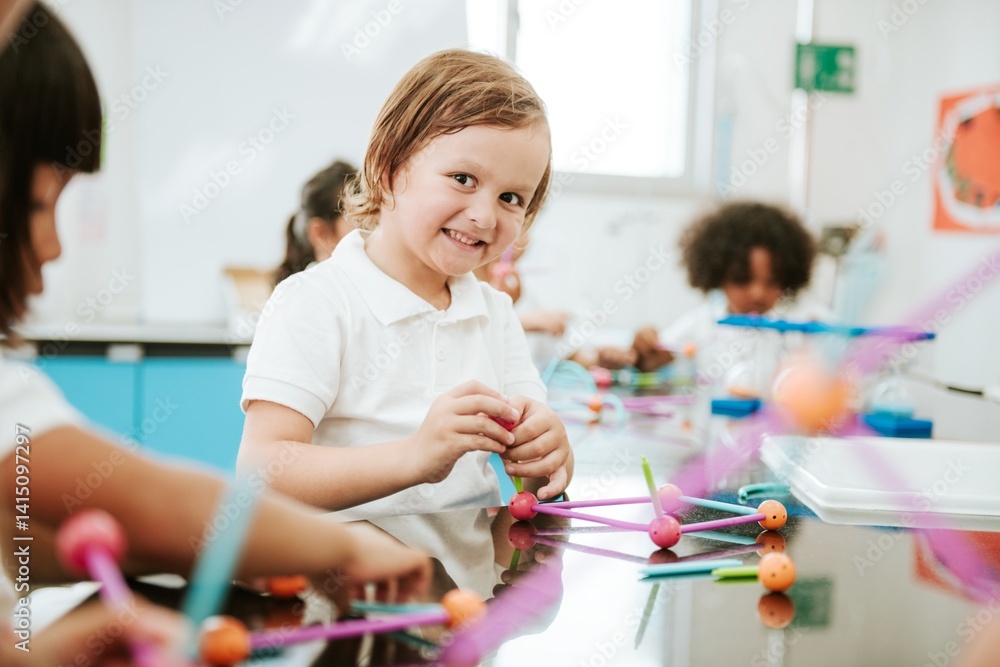 Poster young caucasian boy smiling in a science classroom. student boy learning in science classroom activi