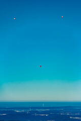 Alpine winter view with many hot air balloons at Bad Kohlgrub, Garmisch-Partenkirchen, Bavaria, Germany